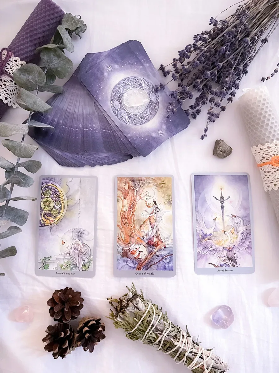 Tarot cards arranged beside lavender for a quiet journaling session