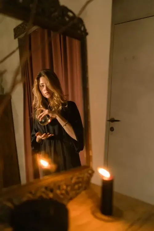 Reflection of a woman holding a crystal ball