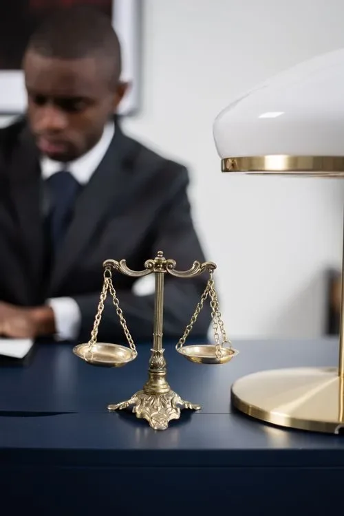 Brass balance scales on a wooden desk