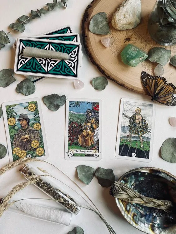 Tarot cards arranged on a table for a reflective reading