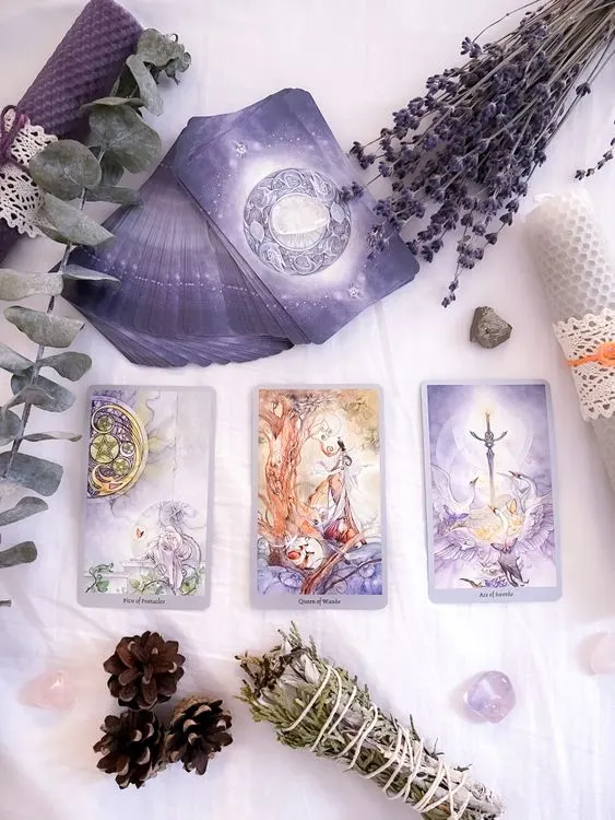Tarot cards arranged with lavender-toned objects for a reflective reading